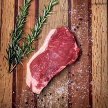 Load image into Gallery viewer, Foggy Bottoms Boys New York Steak on wooden cutting board